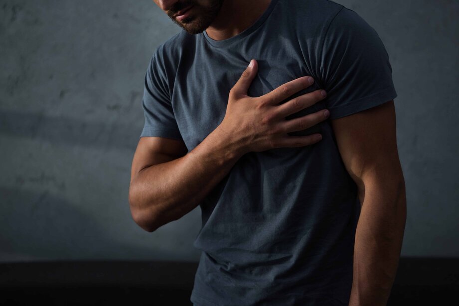 cropped-view-of-man-having-chest-pain-and-heart-atc