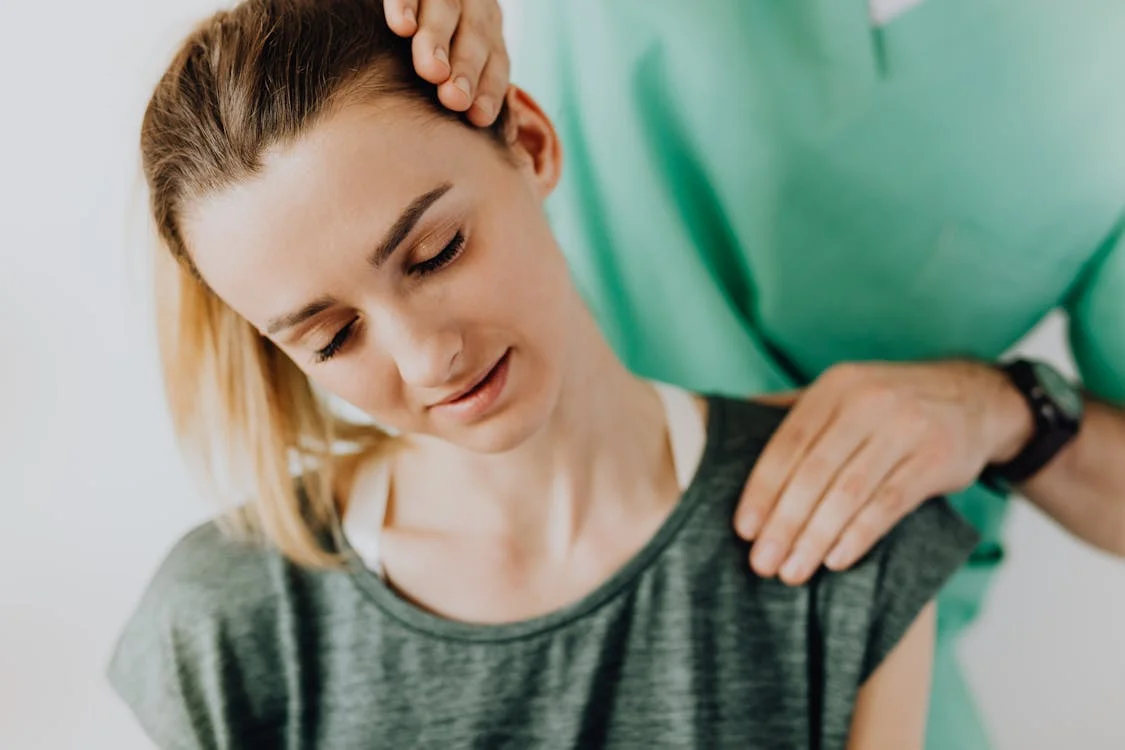 Woman getting a neck massage from a professional therapist!