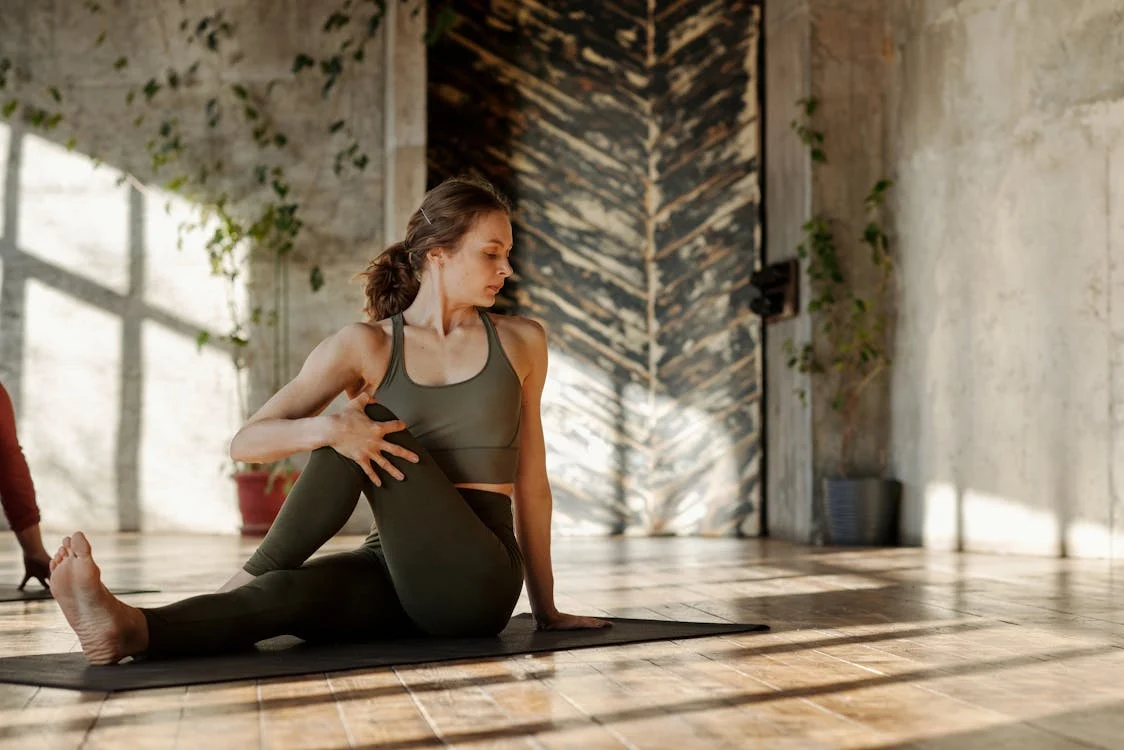 Woman stretching on a yoga mat