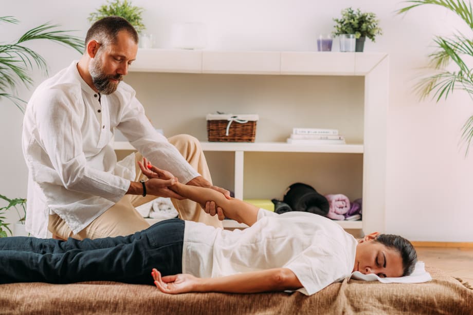 Therapist Massaging the Heart Meridian