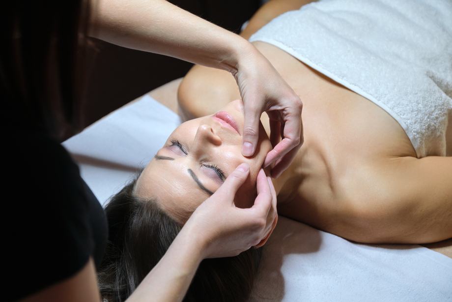 mature-woman-face-massage-beautician-doing-facial-massage
