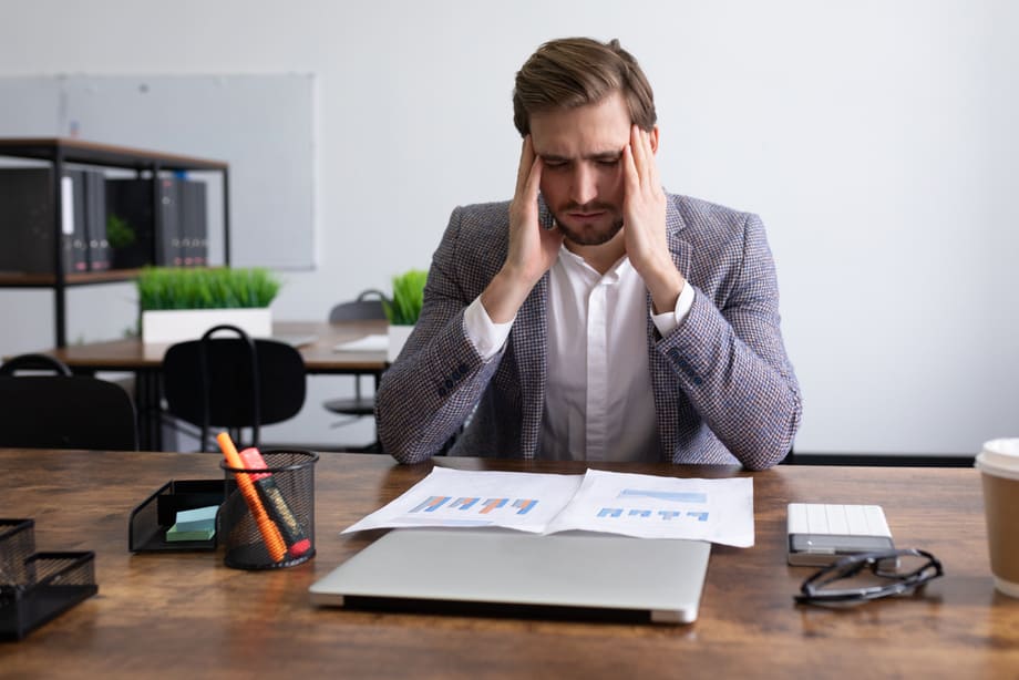 tired-caucasian-businessman-sitting